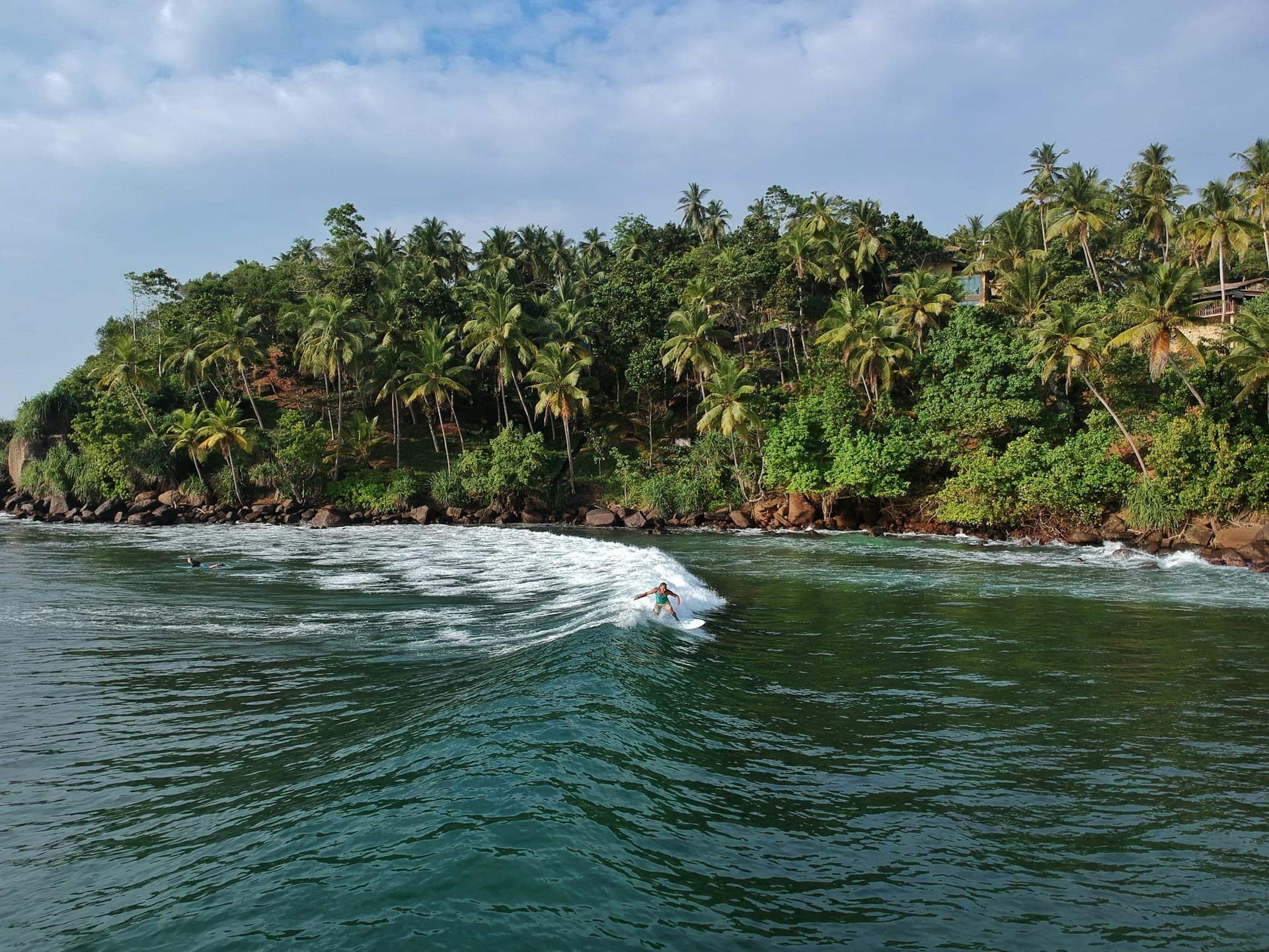 ocean waves towards island during daytime